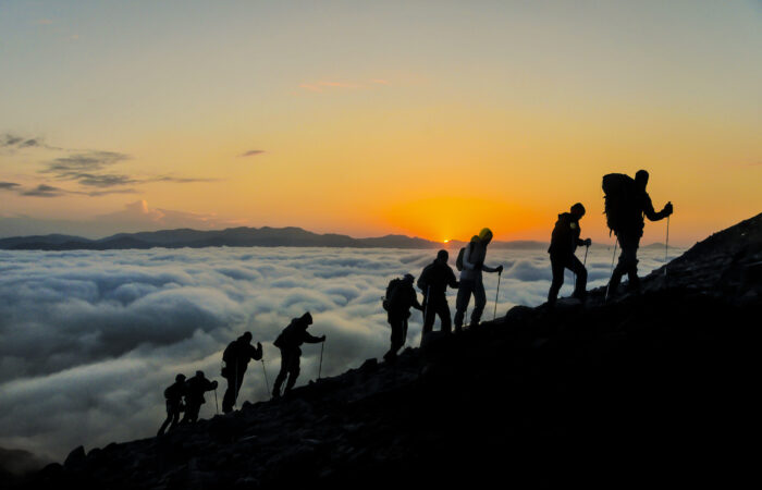 Silhouettes of hikers At Sunset 483629308 2835x1890